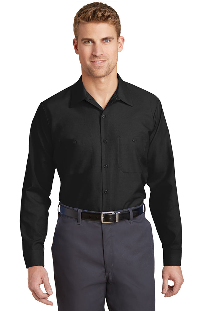 Male model wearing Red Kap Men's Long Sleeve Industrial Work Shirt in black, featuring button-front closure and dual chest pockets