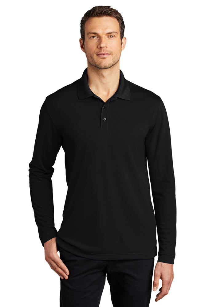 Model in Port Authority Dry Zone Long Sleeve Polo in deep black, featuring breathable mesh fabric, moisture-wicking performance, and a relaxed fit with polo collar.
