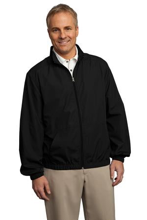 Male model wearing Port Authority Men's Essential Jacket in black, featuring full-zip front, stand-up collar, and elastic cuffs.