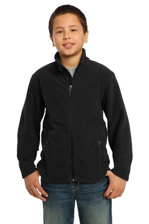 Young boy wearing Port Authority Youth Value Fleece Jacket in black, featuring full-zip front and side zip pockets