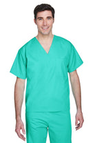 Male model wearing Harriton Adult Restore Unisex V-Neck Scrub Top in teal green, featuring short sleeves and chest pocket.