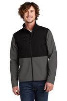  Model wearing The North Face Castle Rock Soft Shell Jacket in asphalt grey, highlighting the technical soft shell material, zip-up front, and chest logo.