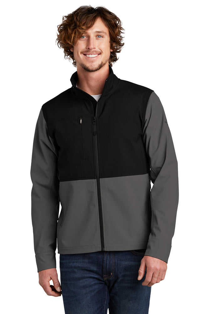  Model wearing The North Face Castle Rock Soft Shell Jacket in asphalt grey, highlighting the technical soft shell material, zip-up front, and chest logo.