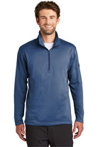Male model in The North Face 1/4-Zip Fleece in blue wing color, featuring a stand collar and performance fleece construction.