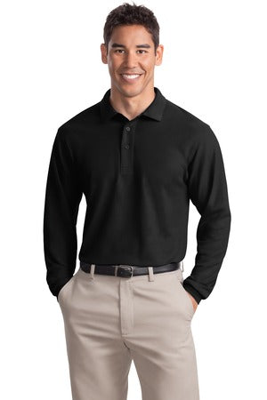  Tall male model in black Port Authority Silk Touch Long Sleeve Polo, featuring a smooth finish, three-button placket, and extended body length for tall sizing.