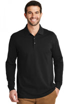 Male model in black Port Authority Long Sleeve Cotton Logo Polo, featuring ribbed cuffs, soft cotton texture, and a clean, professional design.