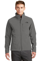  Male model wearing The North Face Apex Barrier Soft Shell Jacket in asphalt grey, showcasing the sleek front-zip design with standing collar and embroidered logo on left chest.