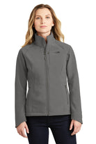  Female model wearing The North Face Ladies Apex Barrier Soft Shell Jacket in asphalt grey, showcasing the tailored silhouette, full front zip, and logo detail.