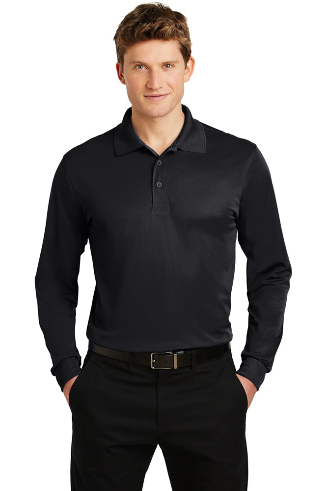  Male model wearing black Sport-Tek Micropique Sport-Wick Long Sleeve Polo, featuring moisture-wicking fabric, three-button placket, and classic polo collar.